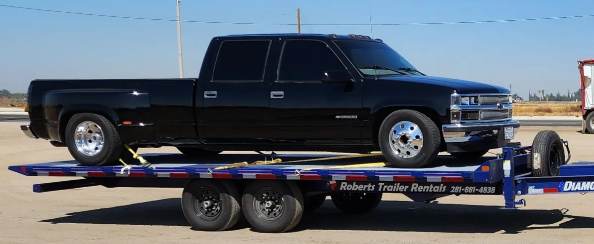 22ft Thing 2 Diamond C equipment trailer rental Coldspring TX - 10000 lb hydraulic tilt deckover with electric winch
